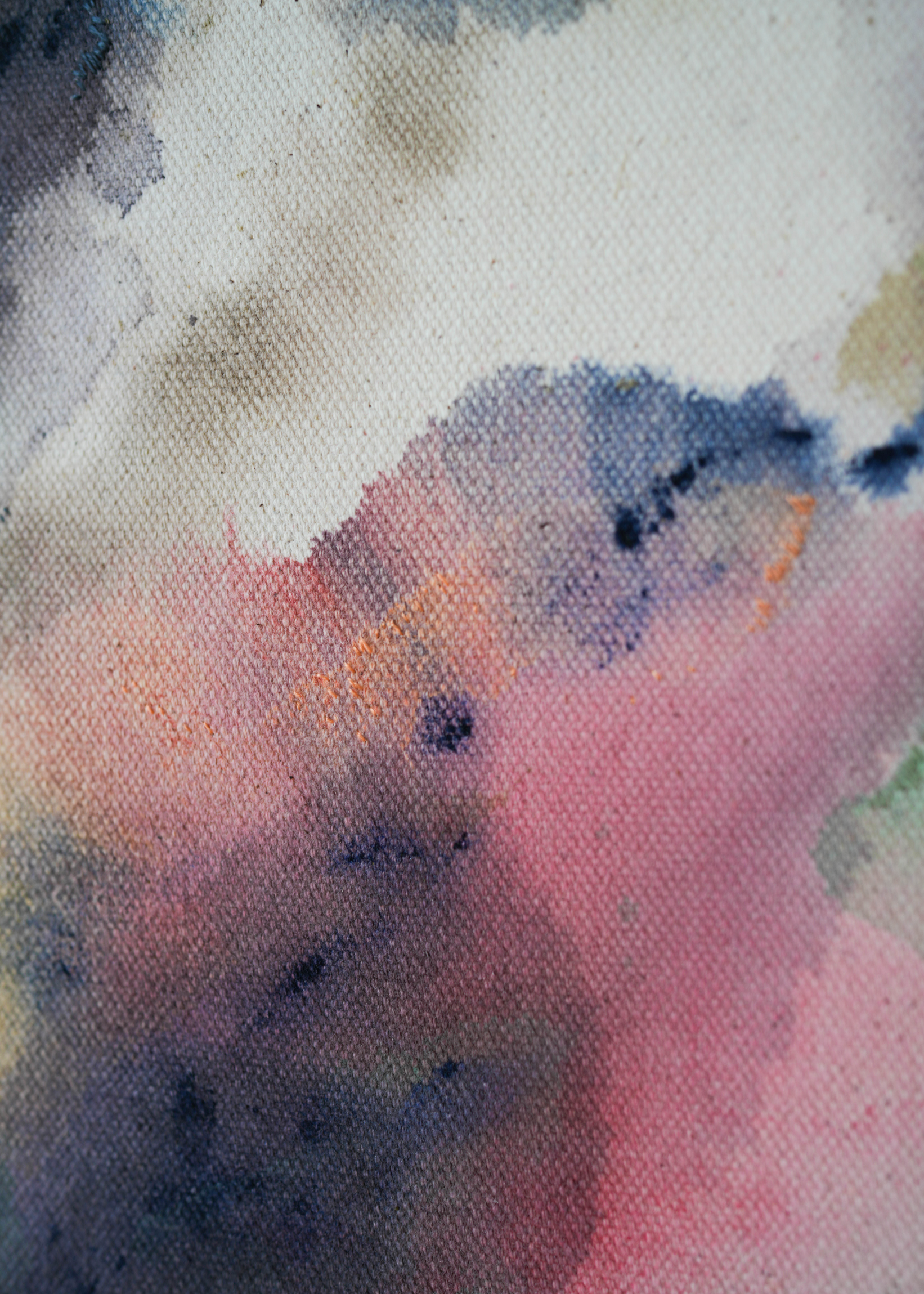 The abstract acrylic painting shows blended swirls of pink, blue, and earthy colors on textured cotton canvas. It creates a calm and peaceful mood.