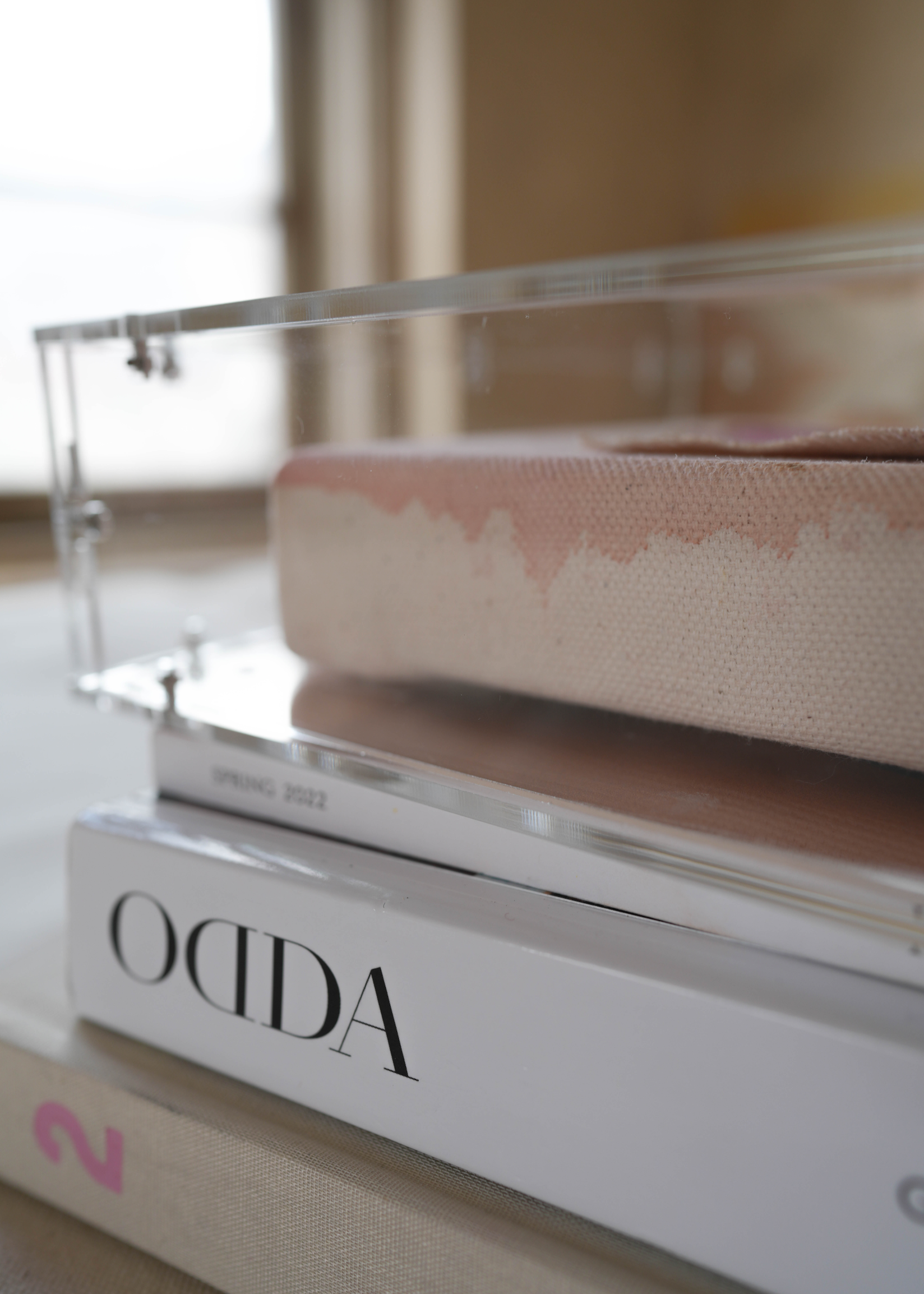 The abstract painting features a soft pink, beige, and orange watercolor background. It has a hand-stitched poem that says, "Healing begins the moment you want it to." This artwork radiates hope and is beautifully framed in clear acrylic.