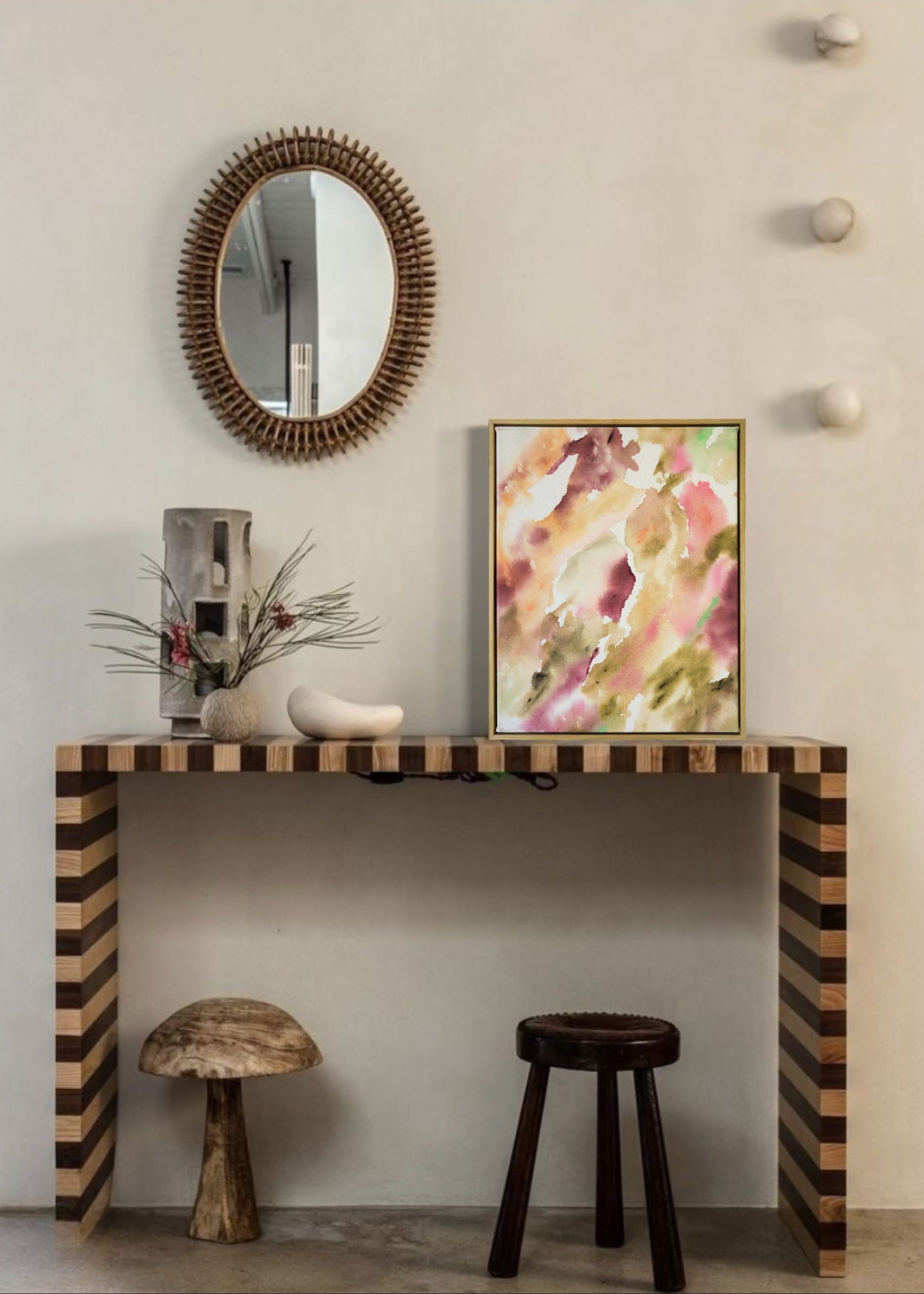 Abstract painting featuring soft, flowing shapes in shades of pink, beige, orange, and green shades, with a textured appearance framed in oak wood.