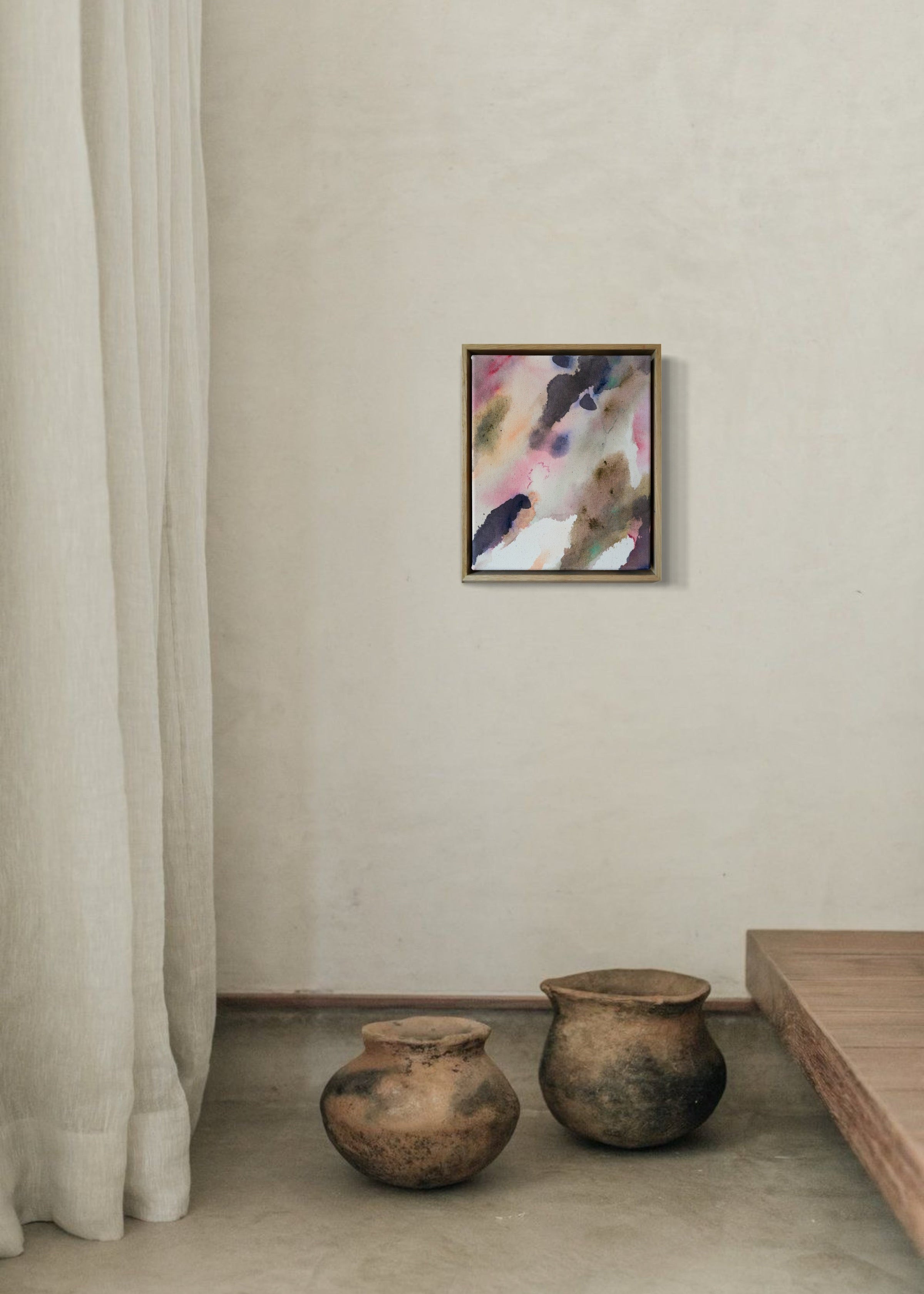 Abstract acrylic painting with soft swirls of pink, purple, and earthy tones, framed in wood. It conveys a serene, dreamy ambiance.