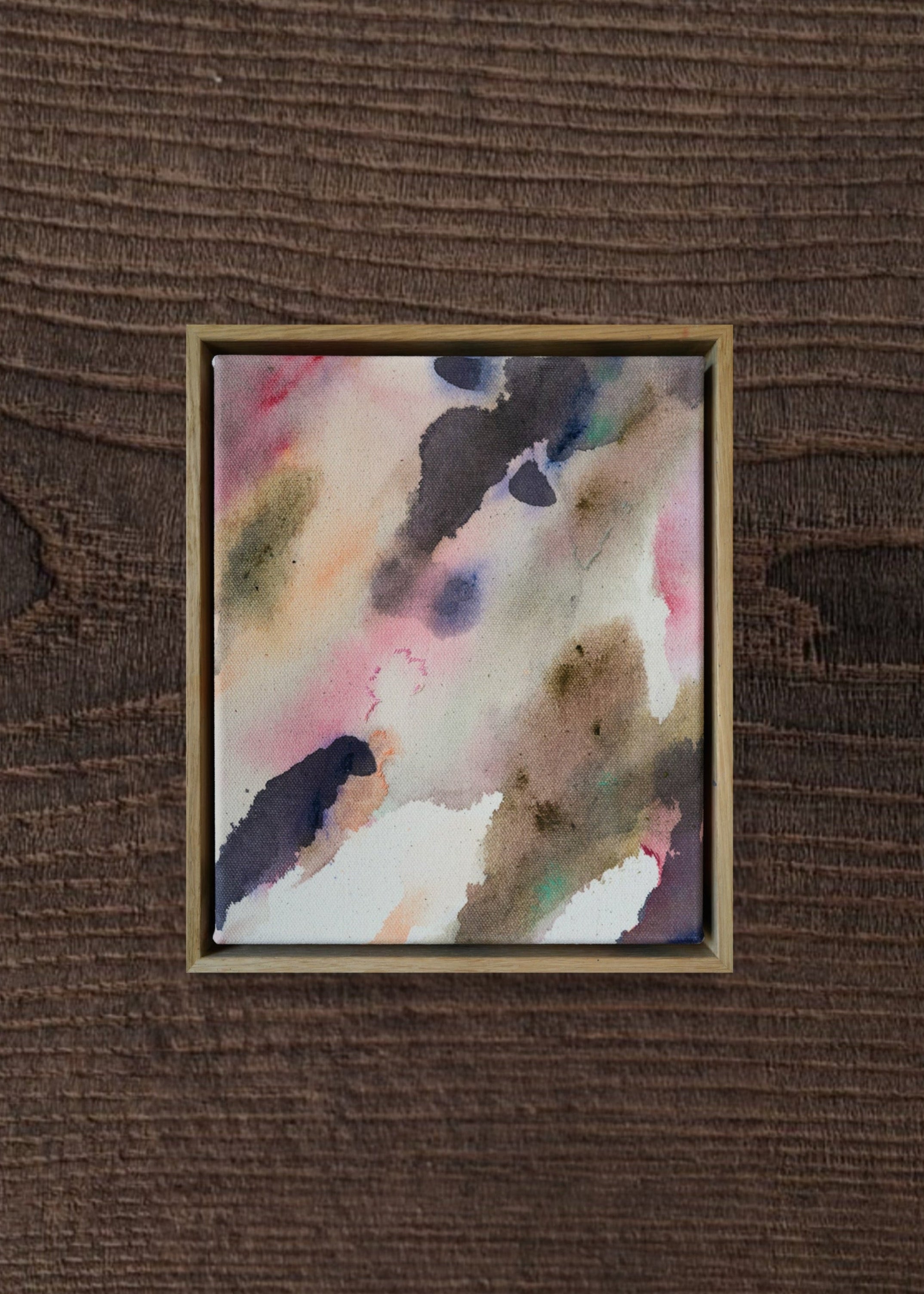 Abstract acrylic painting with soft swirls of pink, purple, and earthy tones, framed in wood. It conveys a serene, dreamy ambiance.