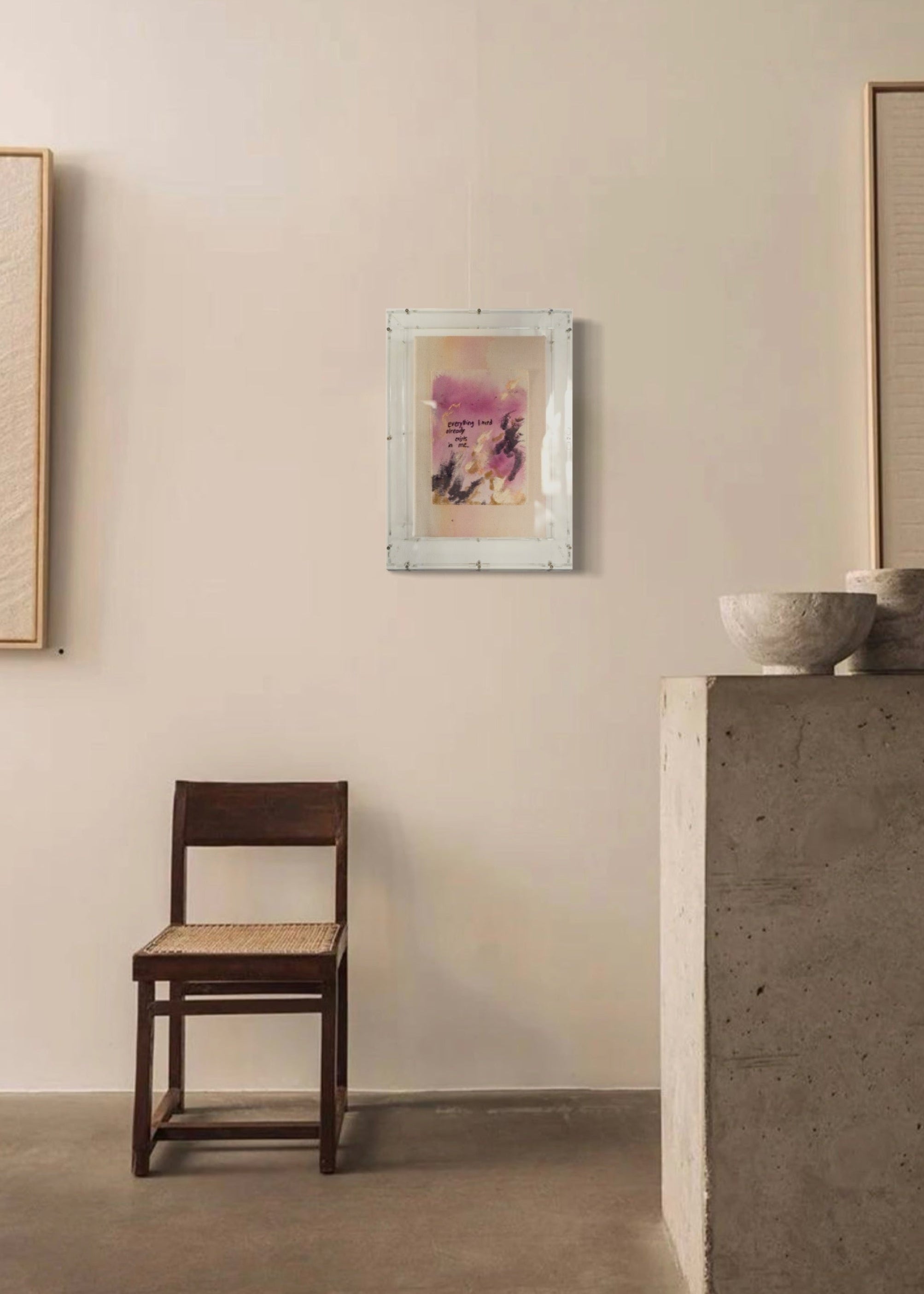 Abstract painting featuring purple, dark purple, and beige brushstrokes on canvas. With a stitched poem that reads, "everything I need already exists in me." Framed in clear acrylic.