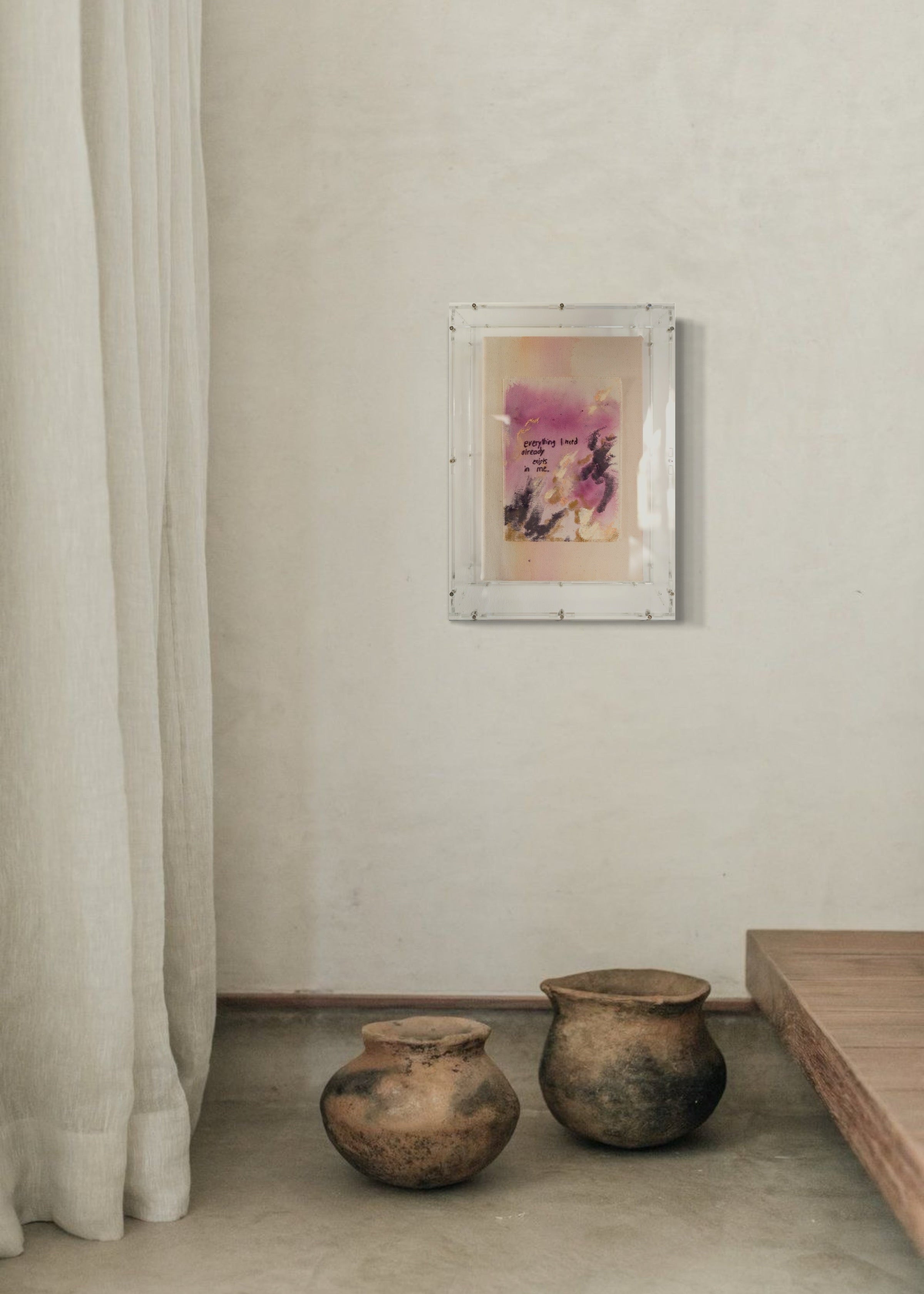 Abstract painting featuring purple, dark purple, and beige brushstrokes on canvas. With a stitched poem that reads, "everything I need already exists in me." Framed in clear acrylic.