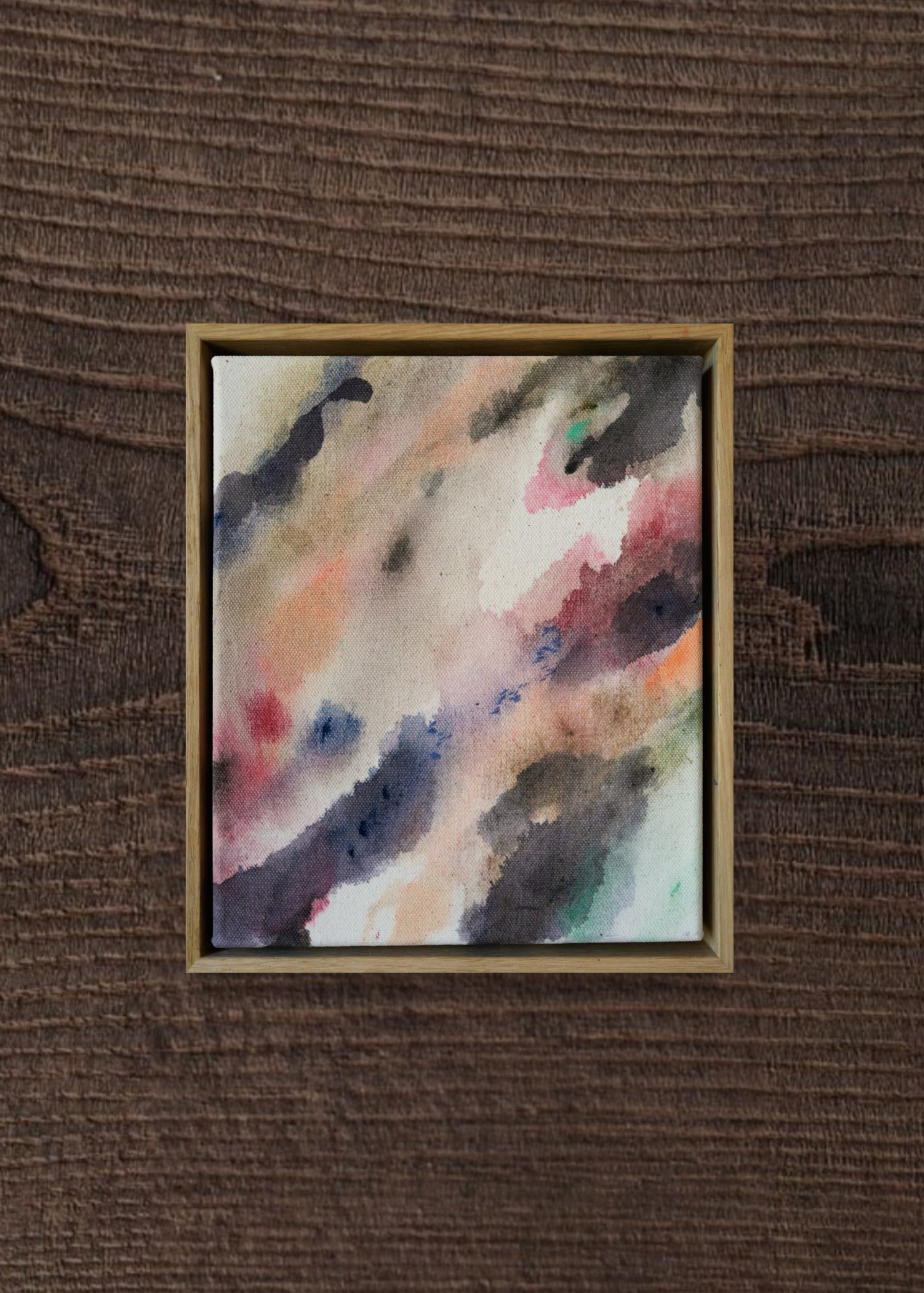 Abstract acrylic painting with flowing shades of pink, brown, and gray on canvas, in a wooden frame. The soft brushstrokes convey a soothing, dreamy emotion.