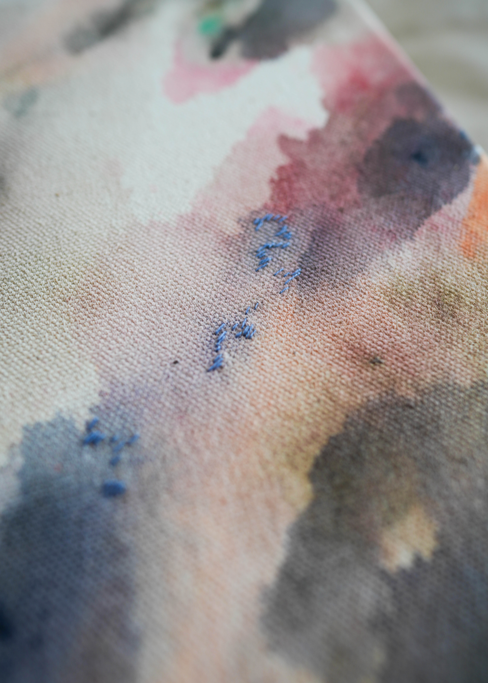 Abstract acrylic painting with flowing shades of pink, brown, and gray on canvas, in a wooden frame. The soft brushstrokes convey a soothing, dreamy emotion.