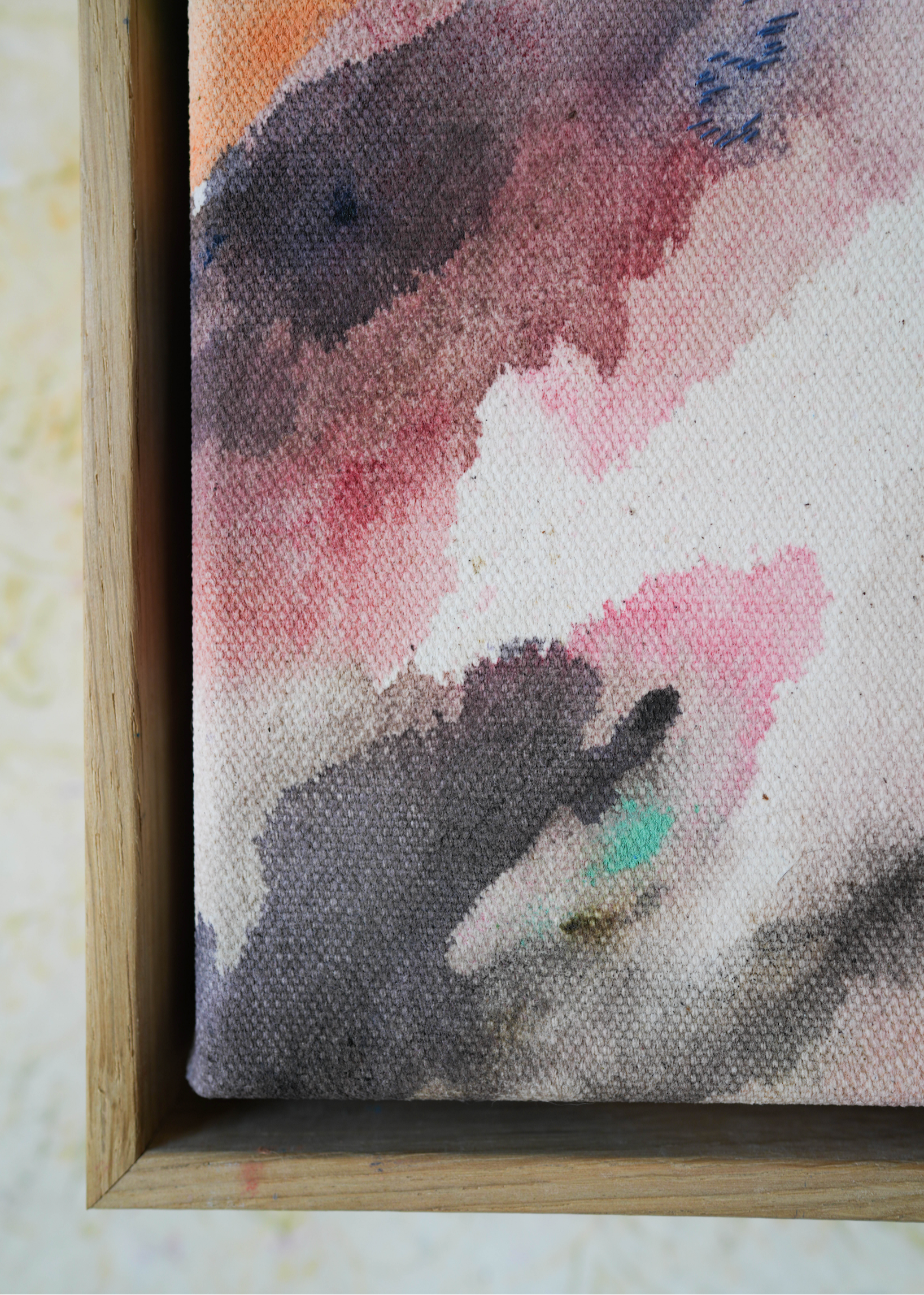 Abstract acrylic painting with flowing shades of pink, brown, and gray on canvas, in a wooden frame. The soft brushstrokes convey a soothing, dreamy emotion.