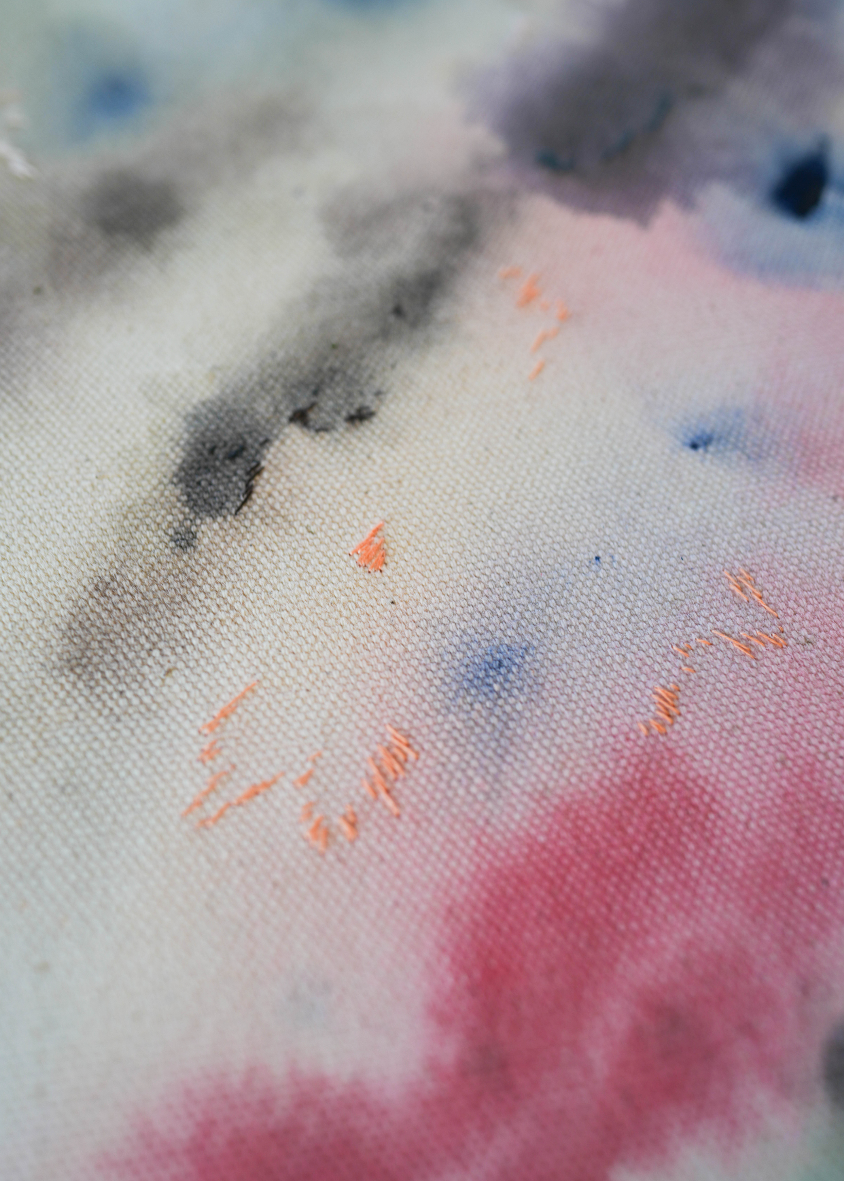 Abstract acrylic, fuid painting in a wooden frame, featuring soft blends of pink, blue, and dark grey. Conveys a dreamy, ethereal mood.