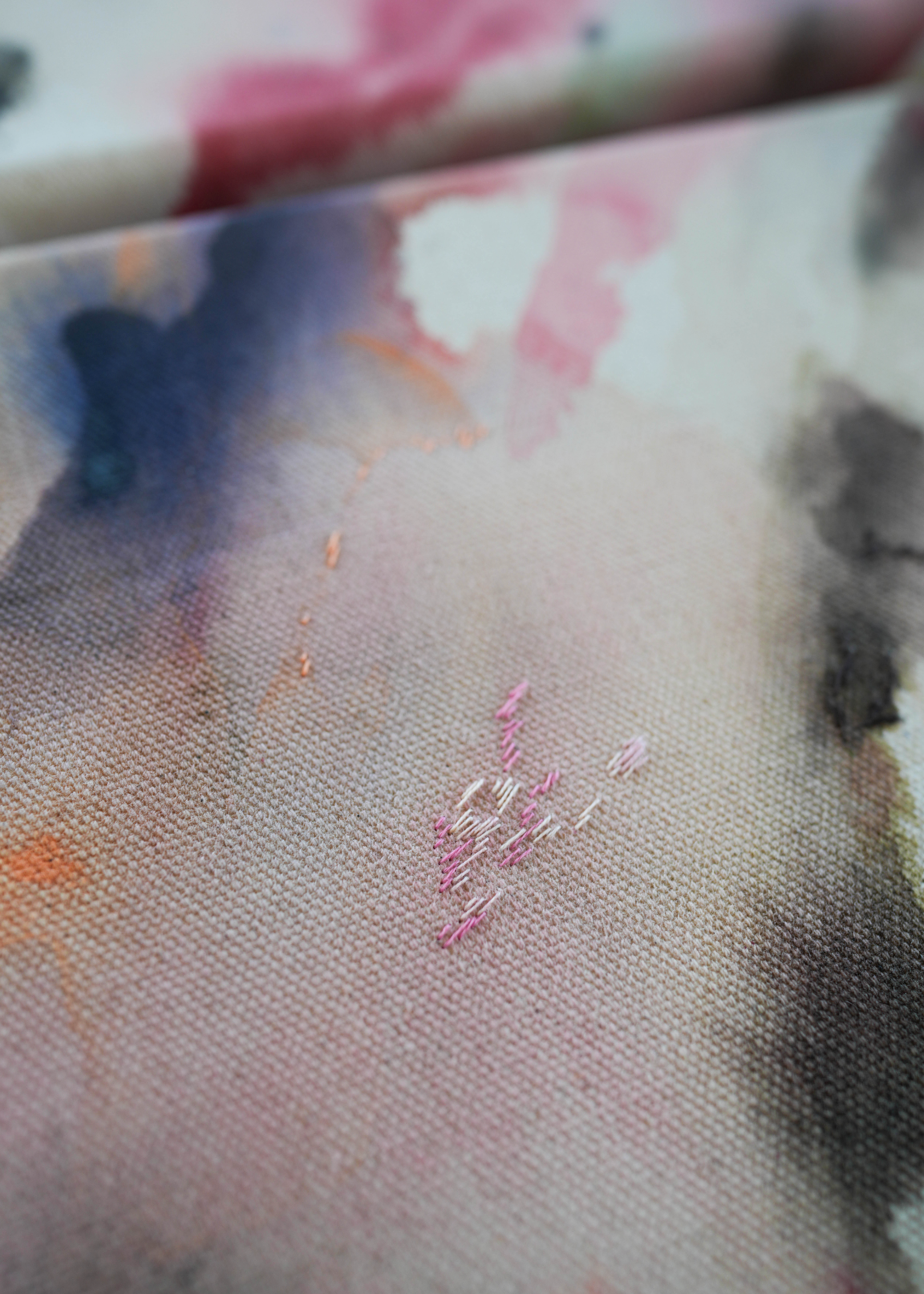 Abstract acrylic painting featuring soft, blended hues of pink, blue, and gray in flowing, harmonious patterns, framed in light wood. Radiates a subtle, tranquil tone perfect for creating a calming atmosphere.