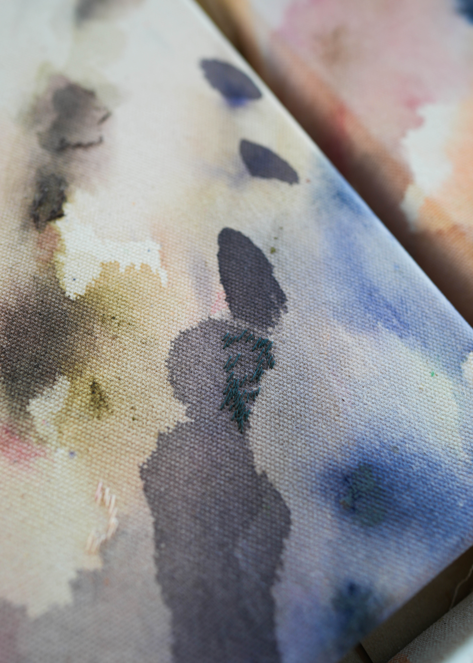 Abstract acrylic painting featuring soft, blended hues of pink, blue, and gray in flowing, harmonious patterns, framed in light wood. Radiates a subtle, tranquil tone perfect for creating a calming atmosphere.