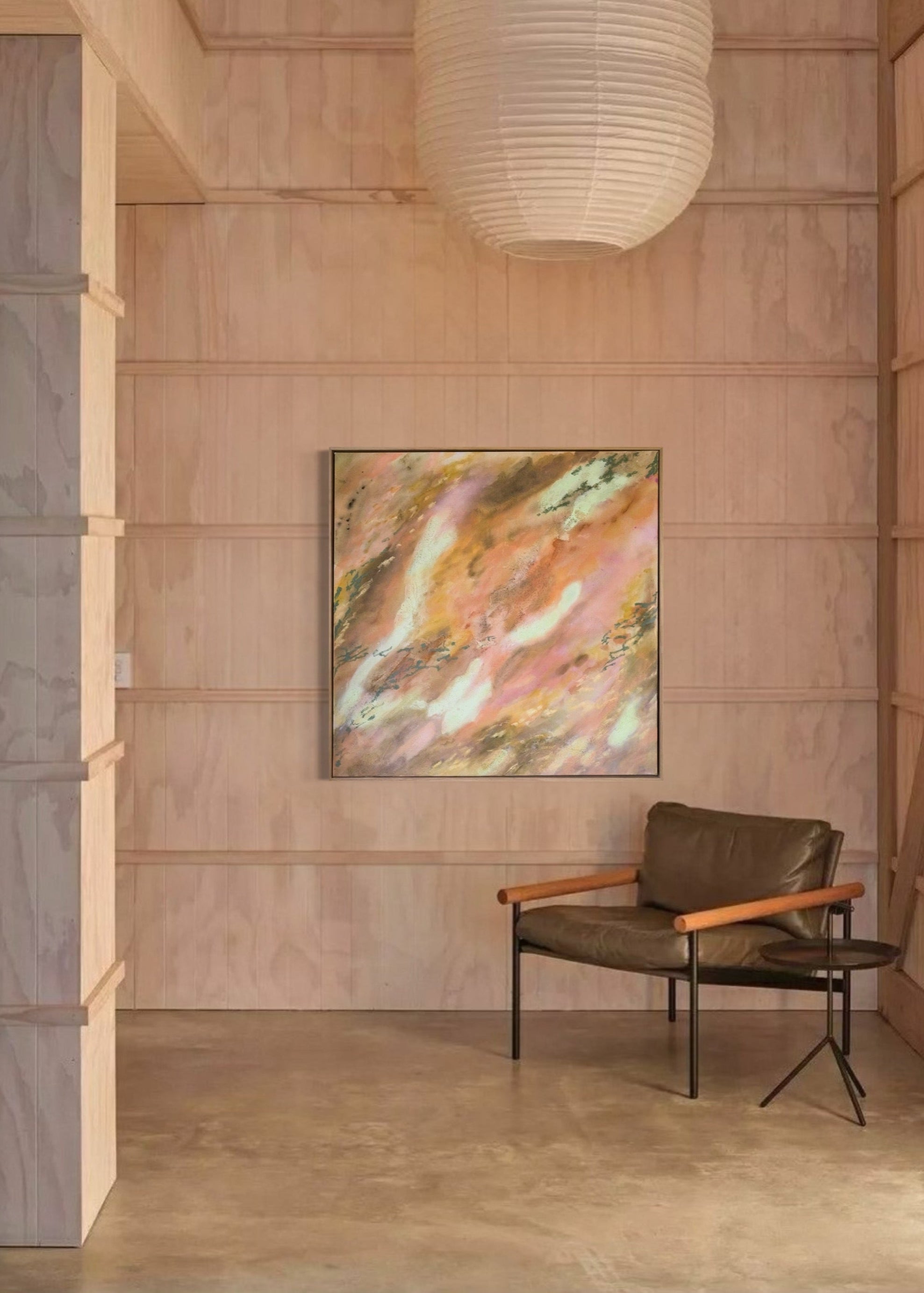Abstrakt artwork featuring swirling patterns in earthy tones, orange, olive, yellow and pastel tones in turquoise and butter yellow on a textured surface framed in oak wood.