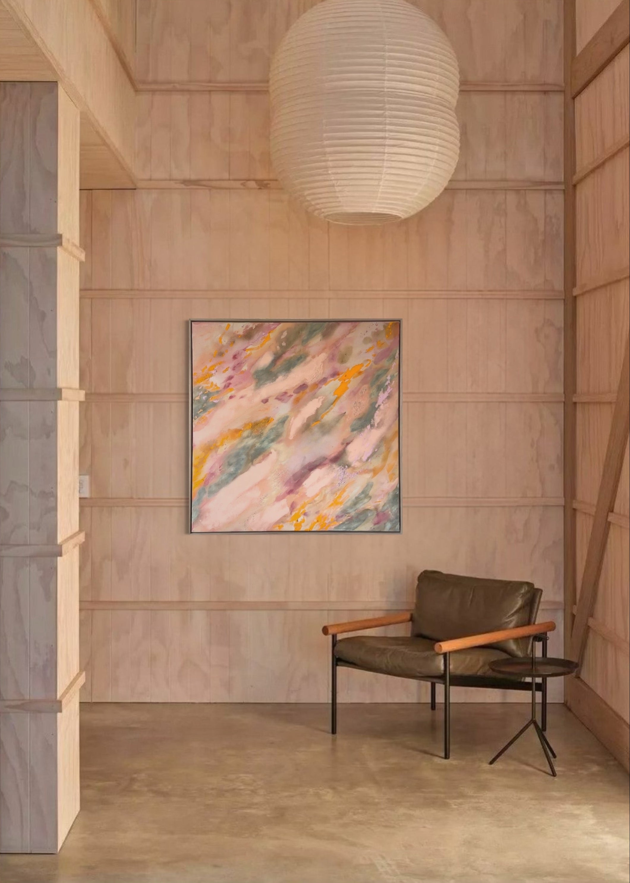 Abstrakt artwork featuring swirling patterns in pink, orange, and pastel tones in green and orange on a textured surface framed in oak wood.