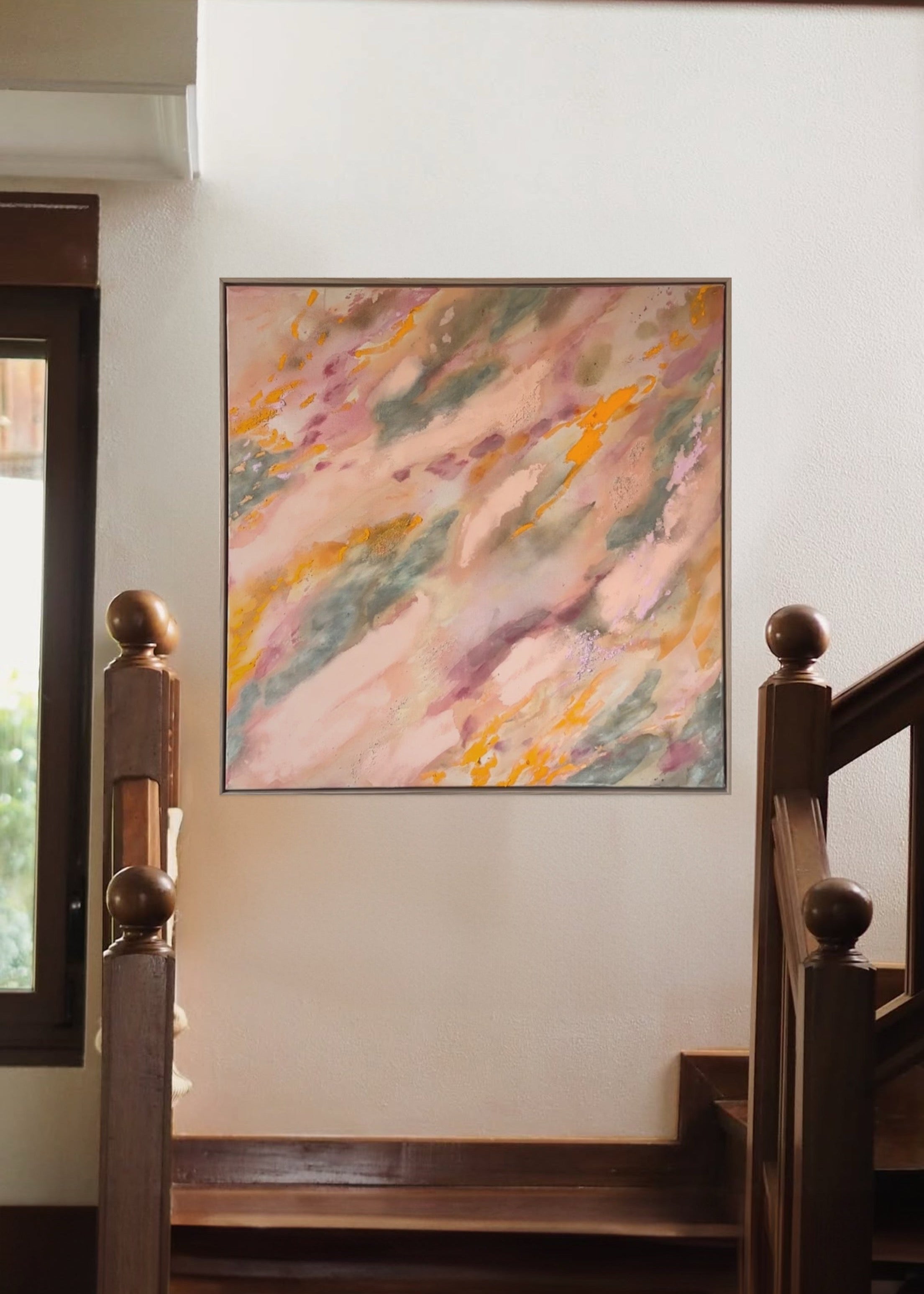 Abstrakt artwork featuring swirling patterns in pink, orange, and pastel tones in green and orange on a textured surface framed in oak wood.