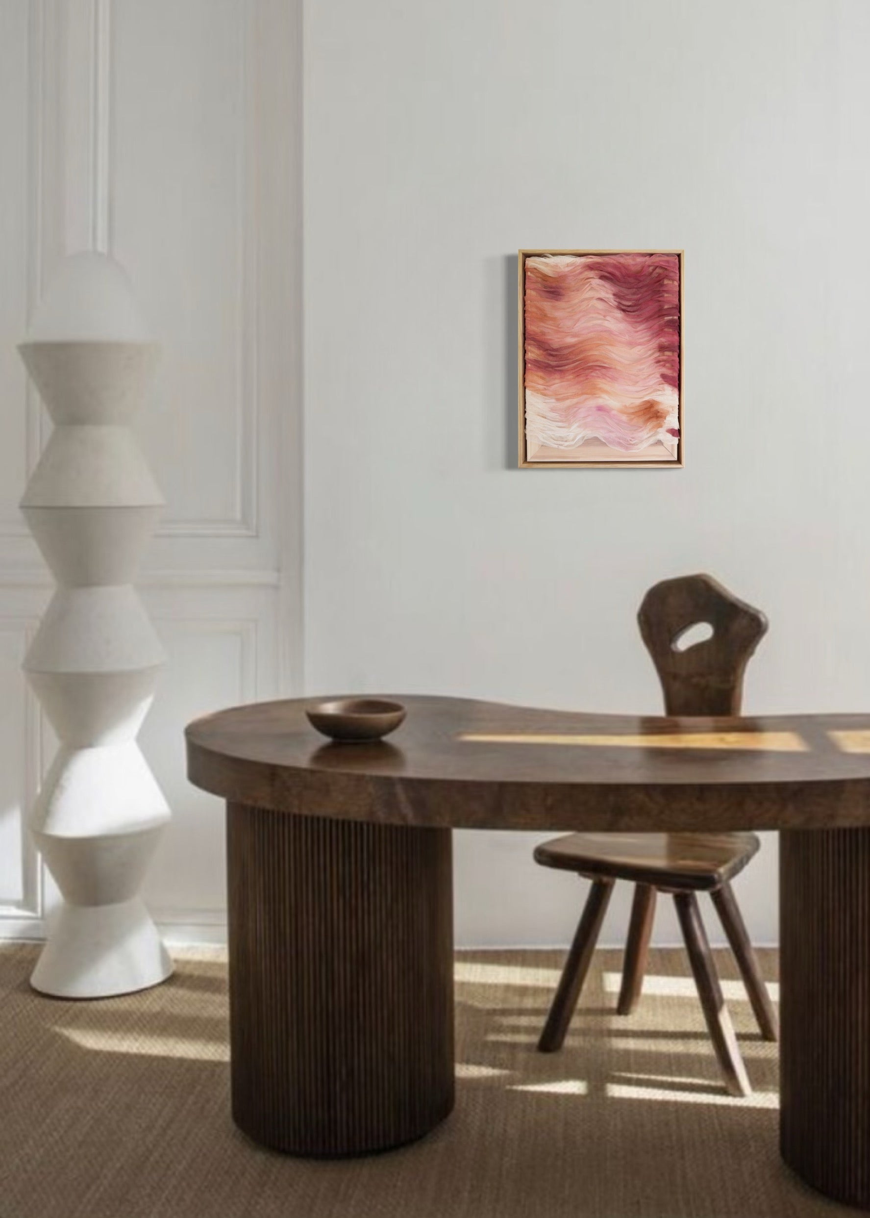 Abstract artwork featuring layered haute couture fabric from Carolina Herrera. Colors include light pink, red, orange, and deep red, arranged in wavy patterns.
