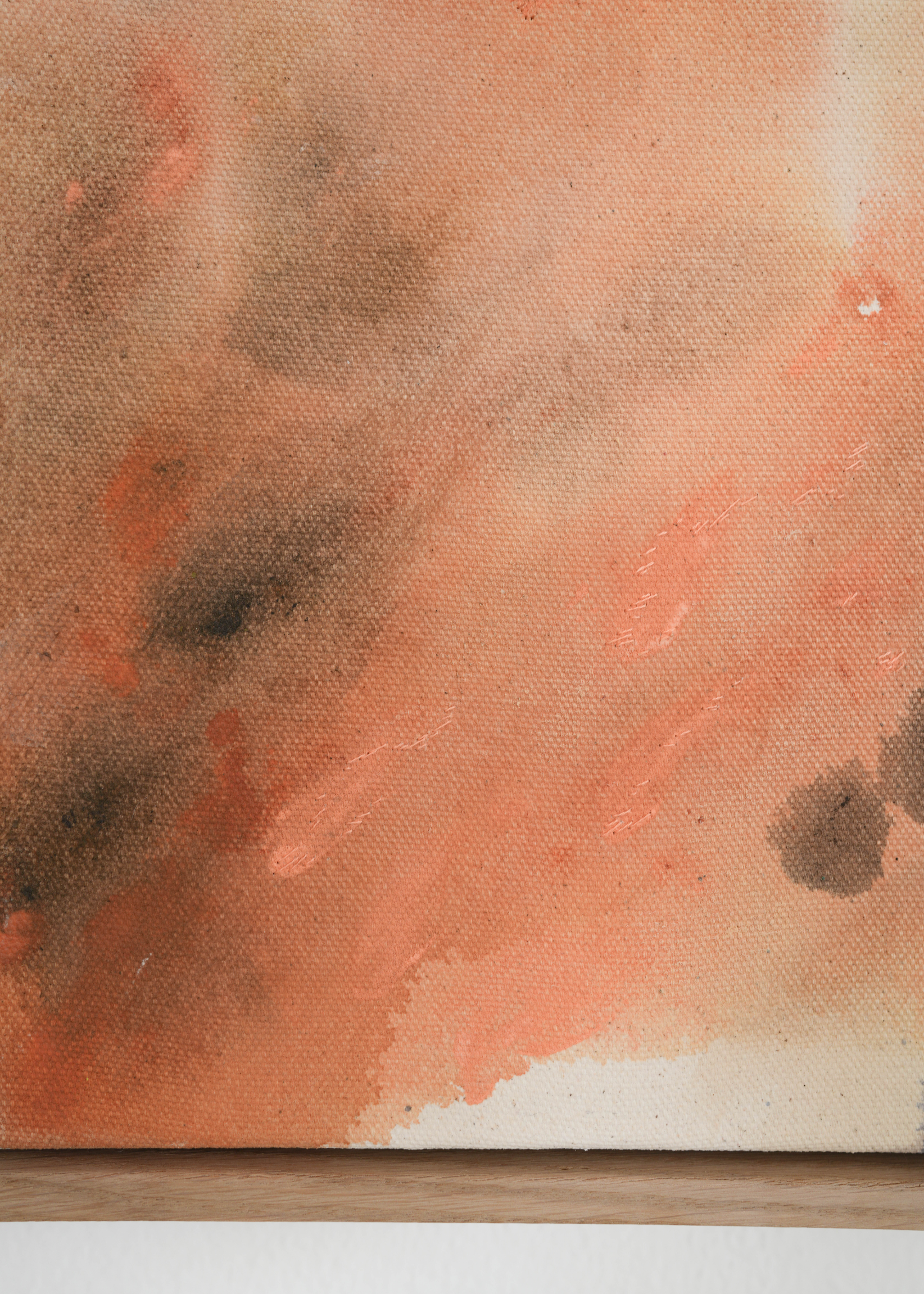 Abstract watercolor in earthy tones such as beige, rose, orange, and brown, with touches of blue and green. The colors flow transparently into one another on a white background, framed in a slim, wooden frame.