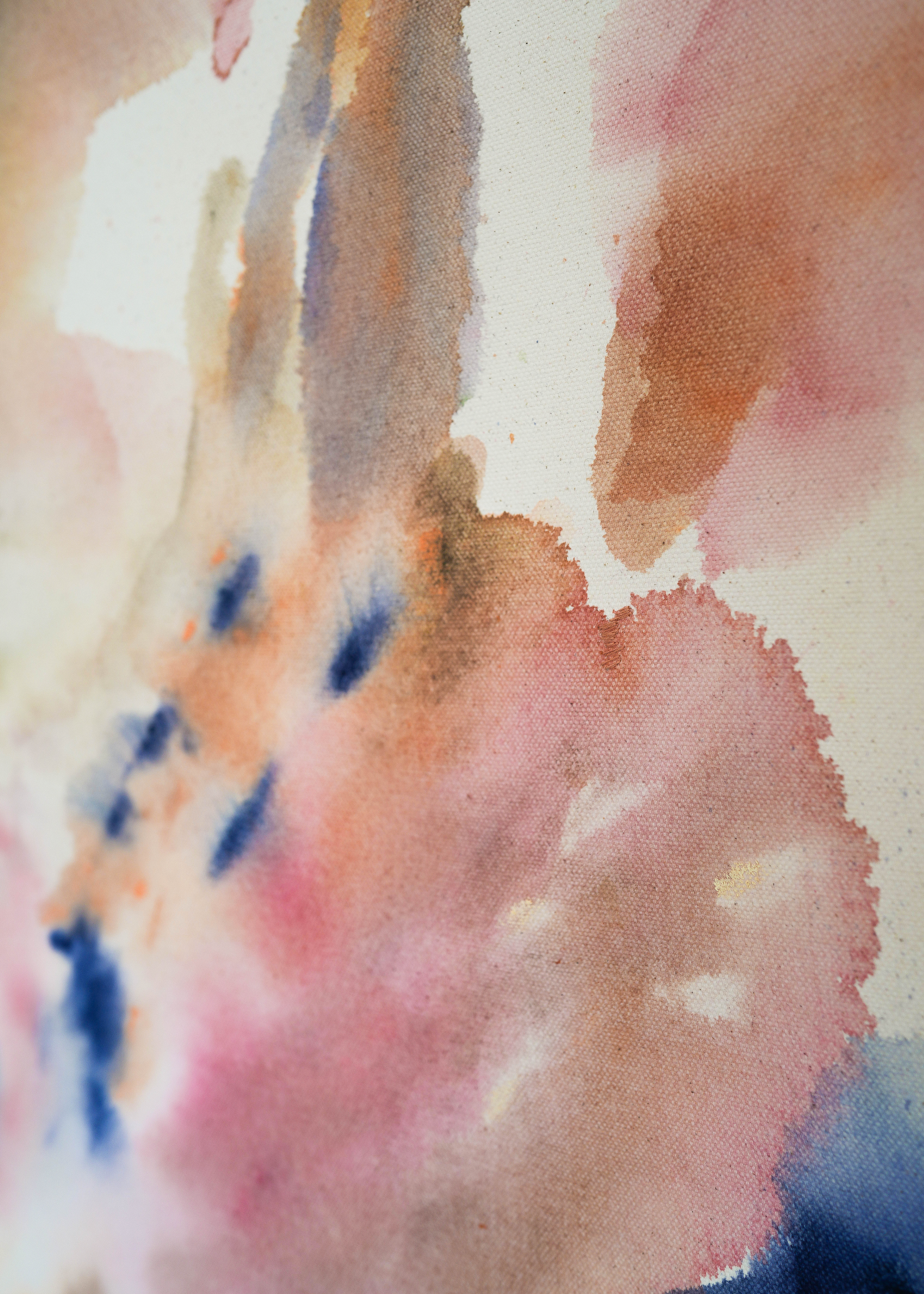 Abstract painting with deep navy brushstrokes layered over soft beige, dusty pink, and muted grey tones. Delicate hand embroidery lines move across the raw cotton canvas, evoking emotional depth and the feeling of inner turbulence and healing.