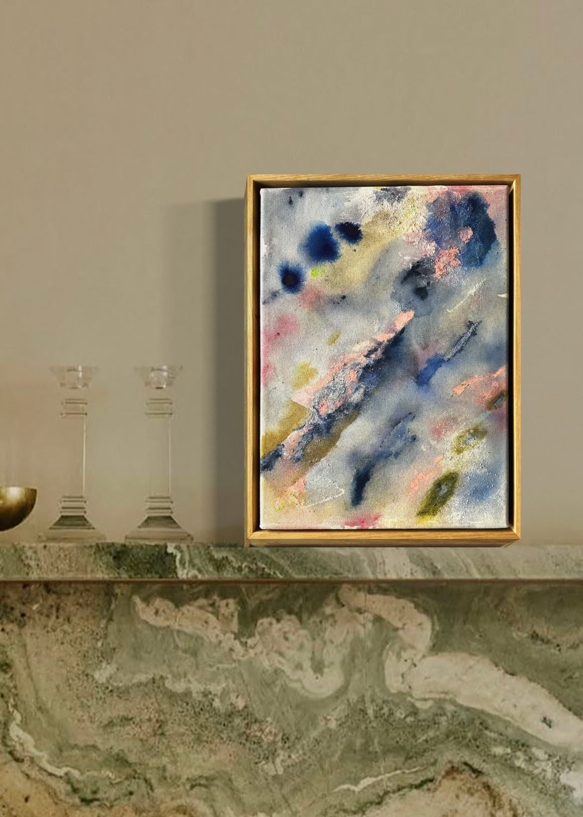 Abstract painting with a textured surface featuring blue, pink, and green hues. The composition includes various brush strokes and splatters.