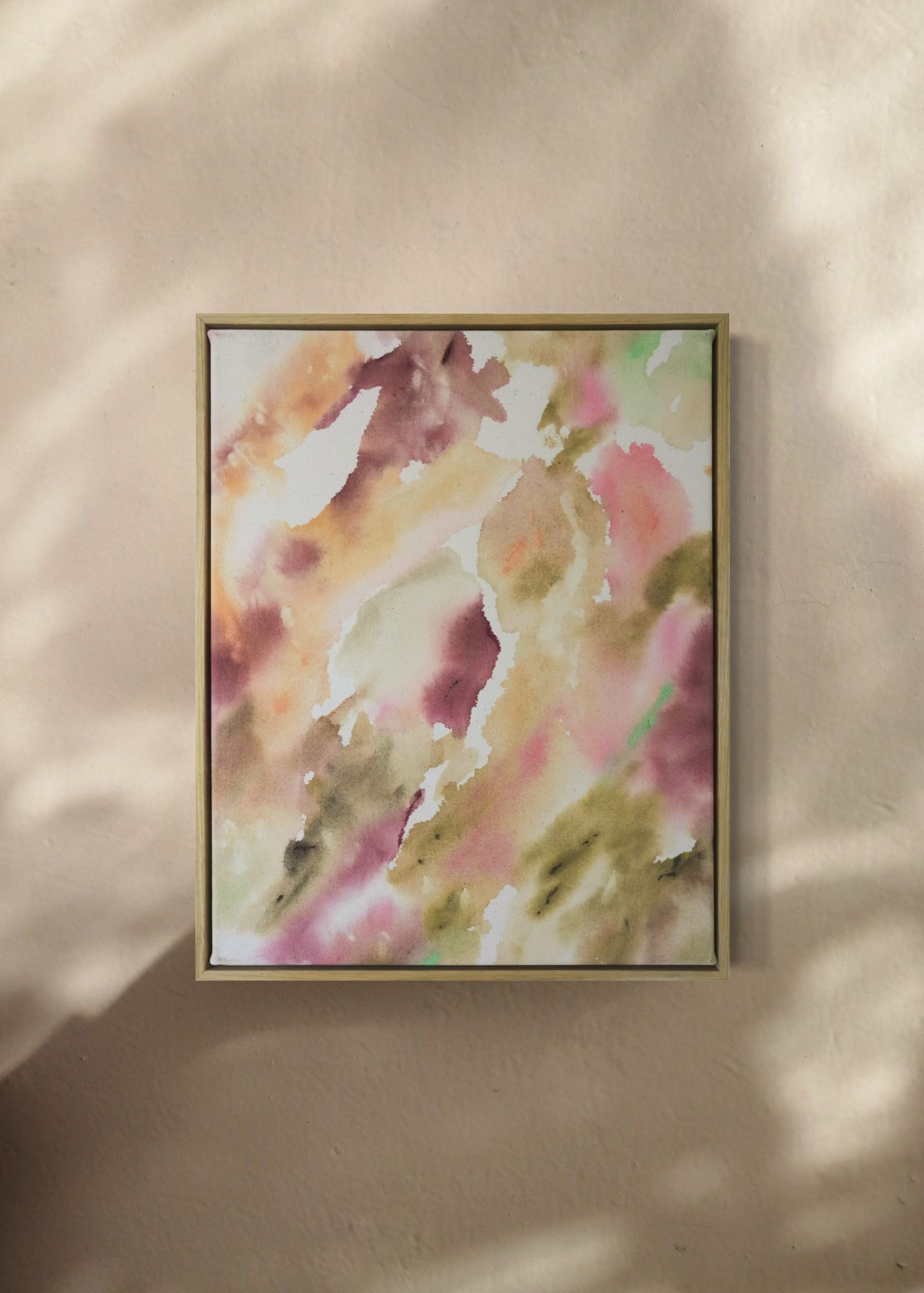 Abstract painting featuring soft, flowing shapes in shades of pink, beige, orange, and green shades, with a textured appearance  framed in oak wood.