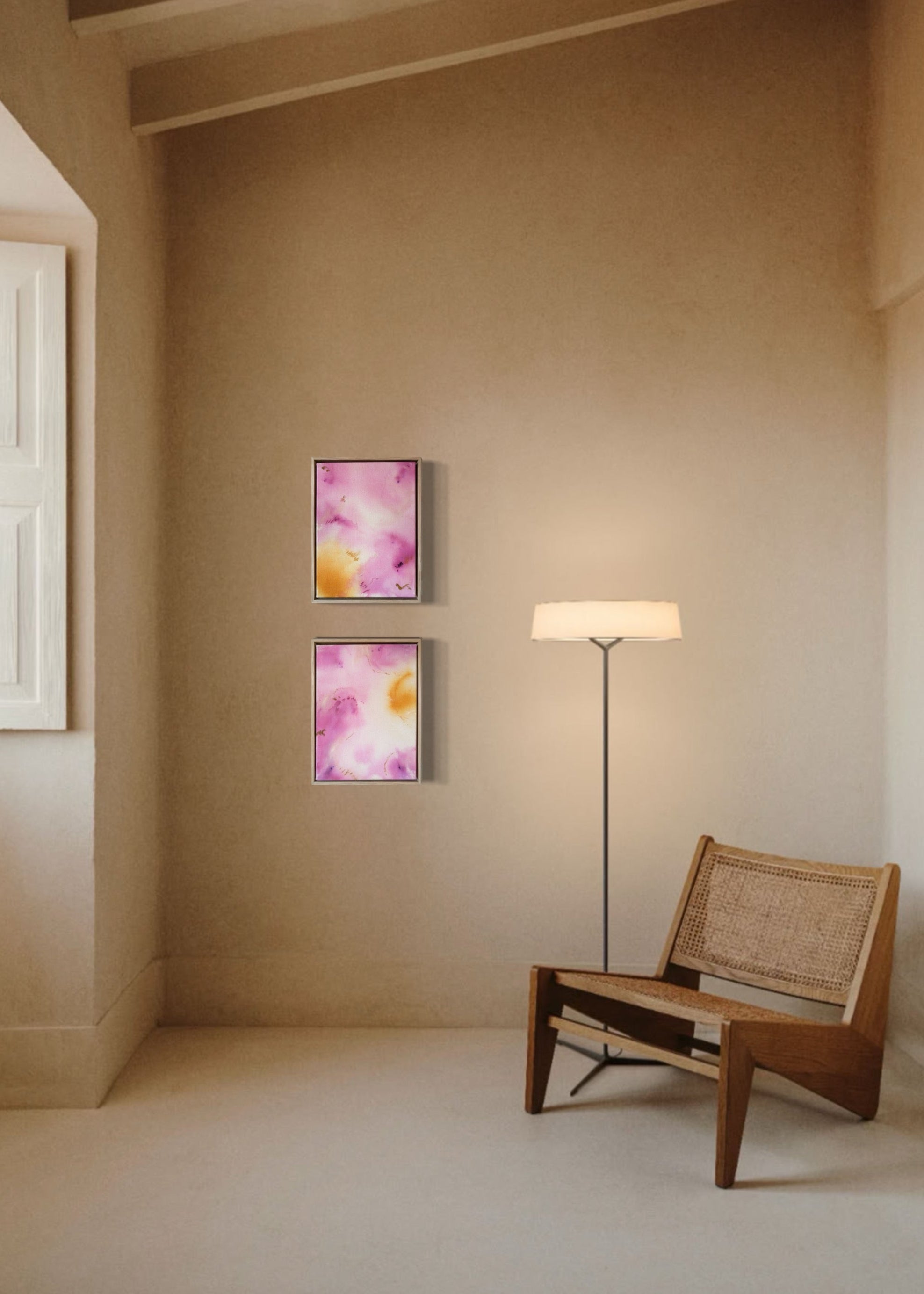 Abstract painting featuring soft pink, purple, and orange hues blending together with embroidery details of gold and dark purple on a canvas, framed in light wood.