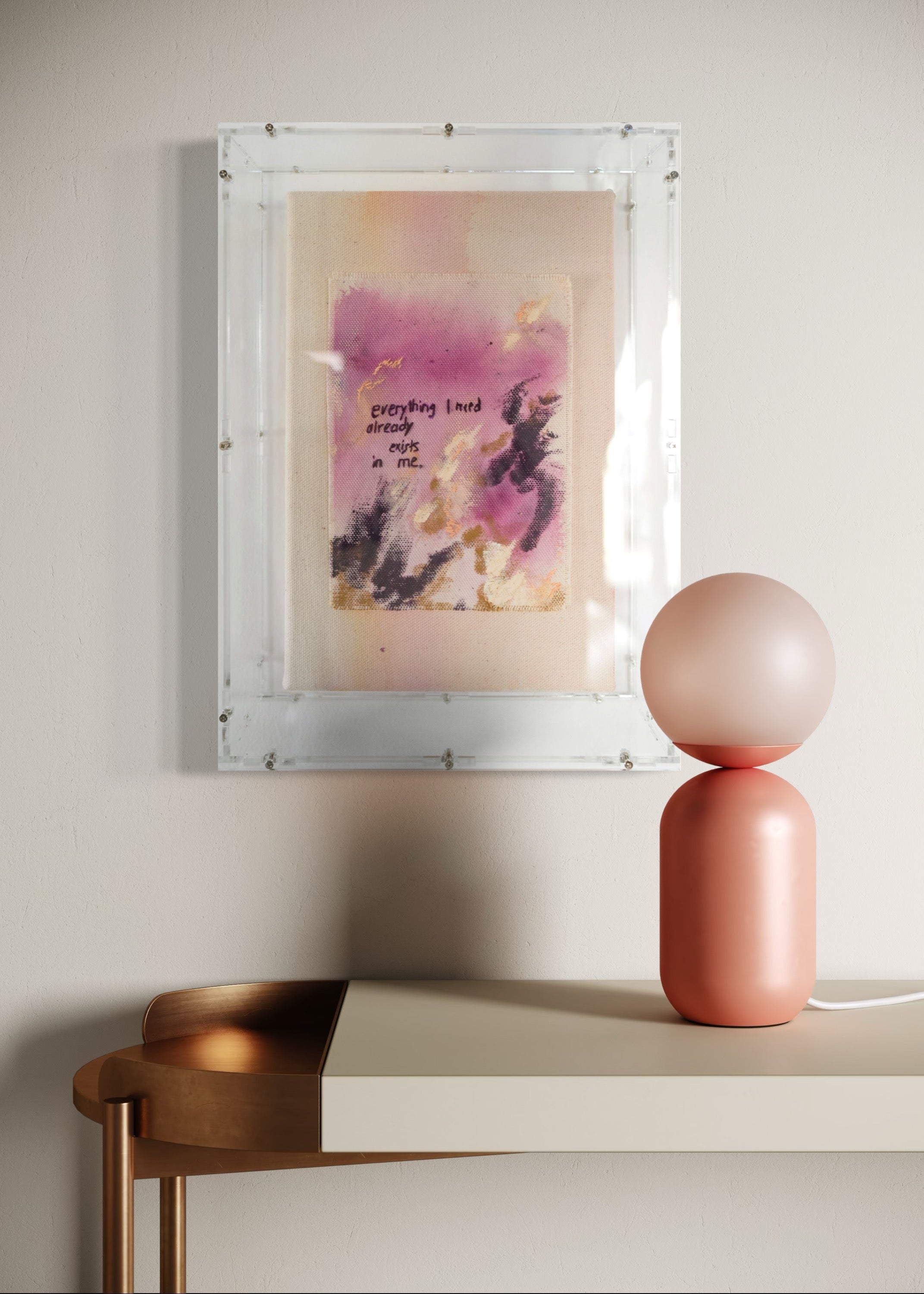 Abstract painting featuring purple, dark purple, and beige brushstrokes on canvas. With a stitched poem that reads, "everything I need already exists in me." Framed in clear acrylic.
