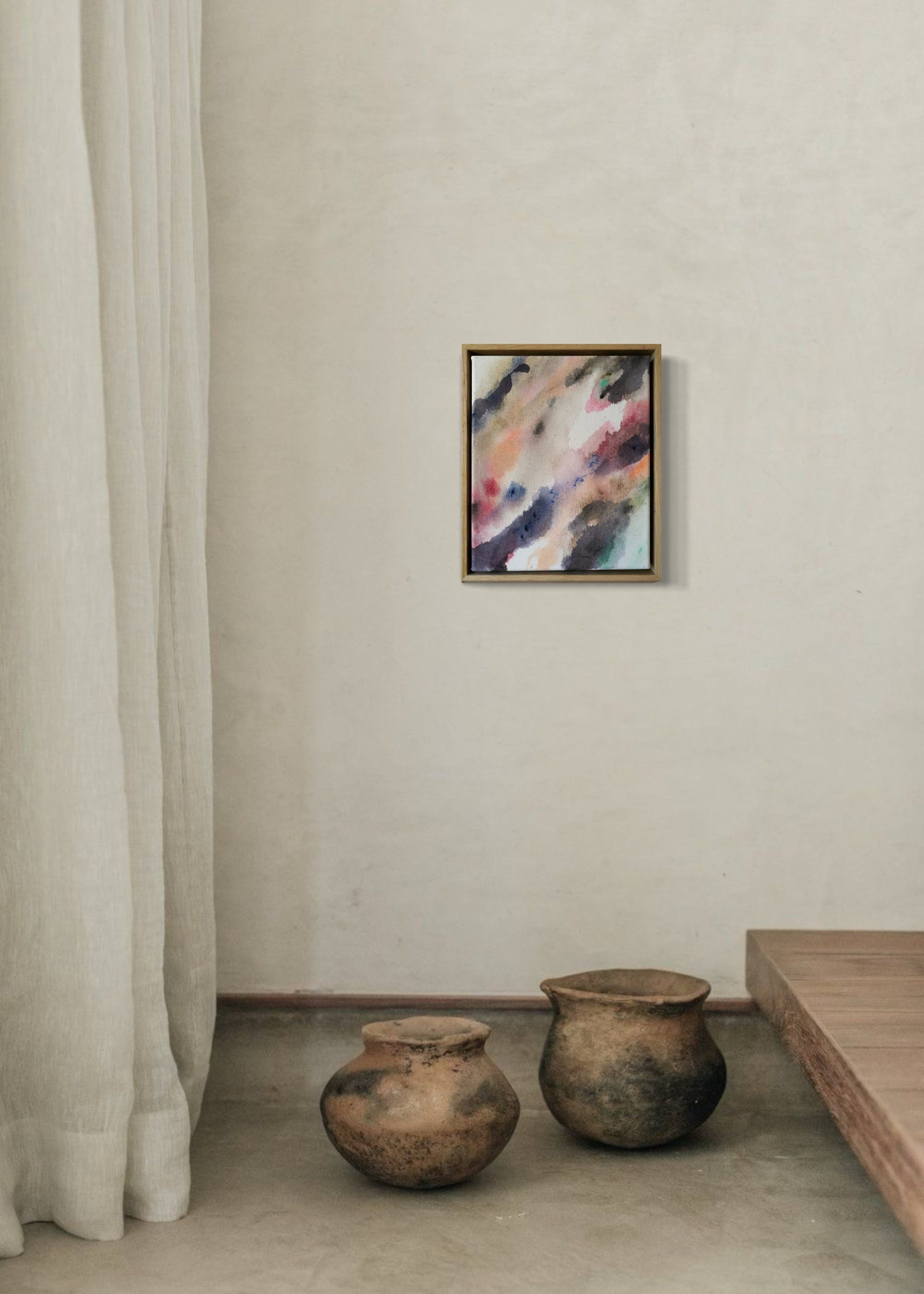 Abstract acrylic painting with flowing shades of pink, brown, and gray on canvas, in a wooden frame. The soft brushstrokes convey a soothing, dreamy emotion.