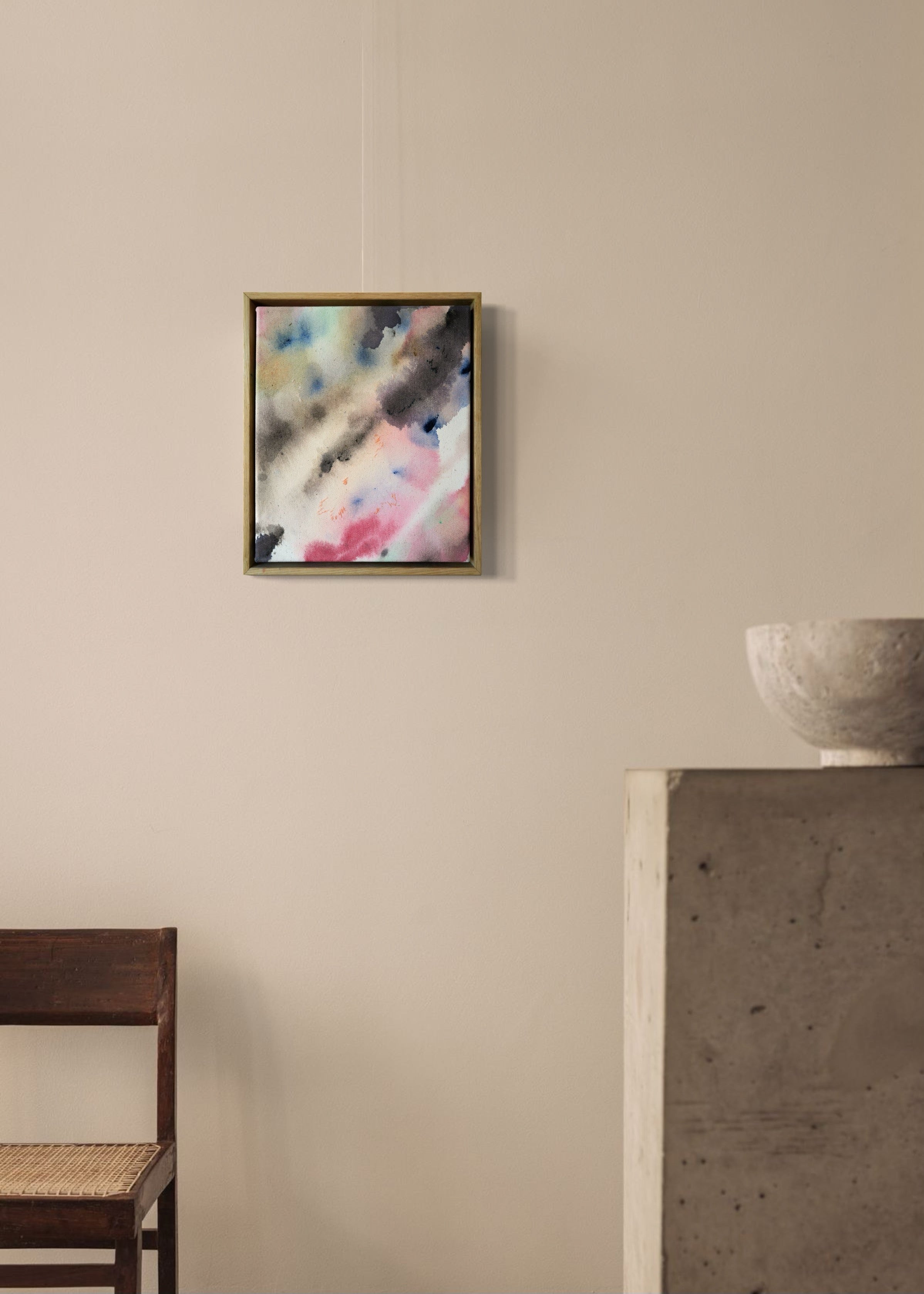 Abstract acrylic, fuid painting in a wooden frame, featuring soft blends of pink, blue, and dark grey. Conveys a dreamy, ethereal mood.