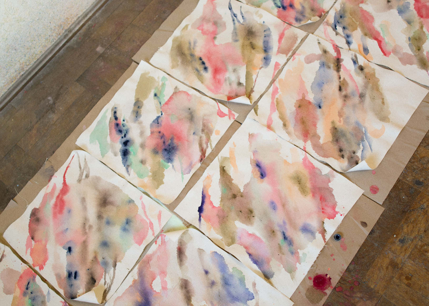 The artist working on multiple small canvases for her upcoming fine art collection about nostalgia.