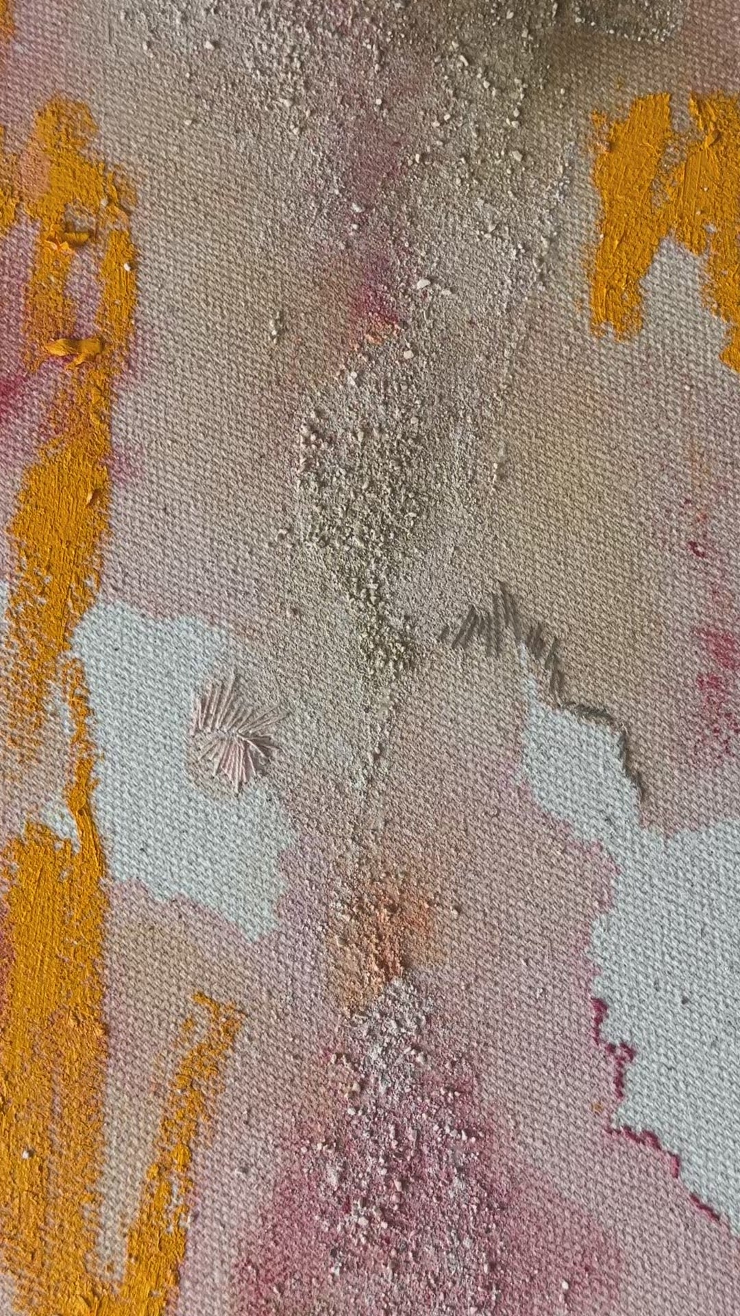 Abstract painting featuring swirling patterns in orange, pink, and beige tones on a textured canvas. Framed in a light wood frame.